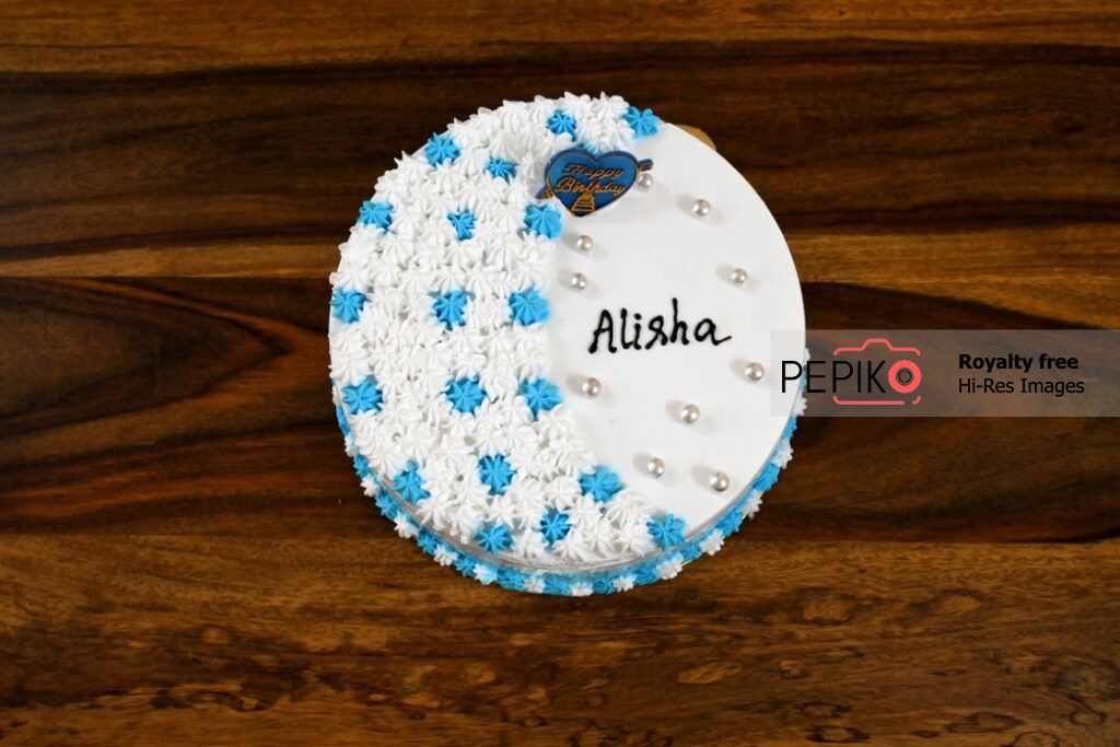 
									Birthday cake with name alisha on it