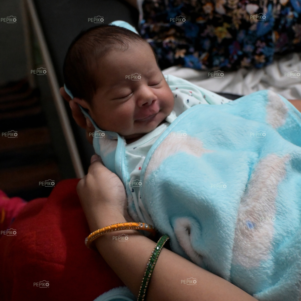 
									New born baby boy in sky blue dress