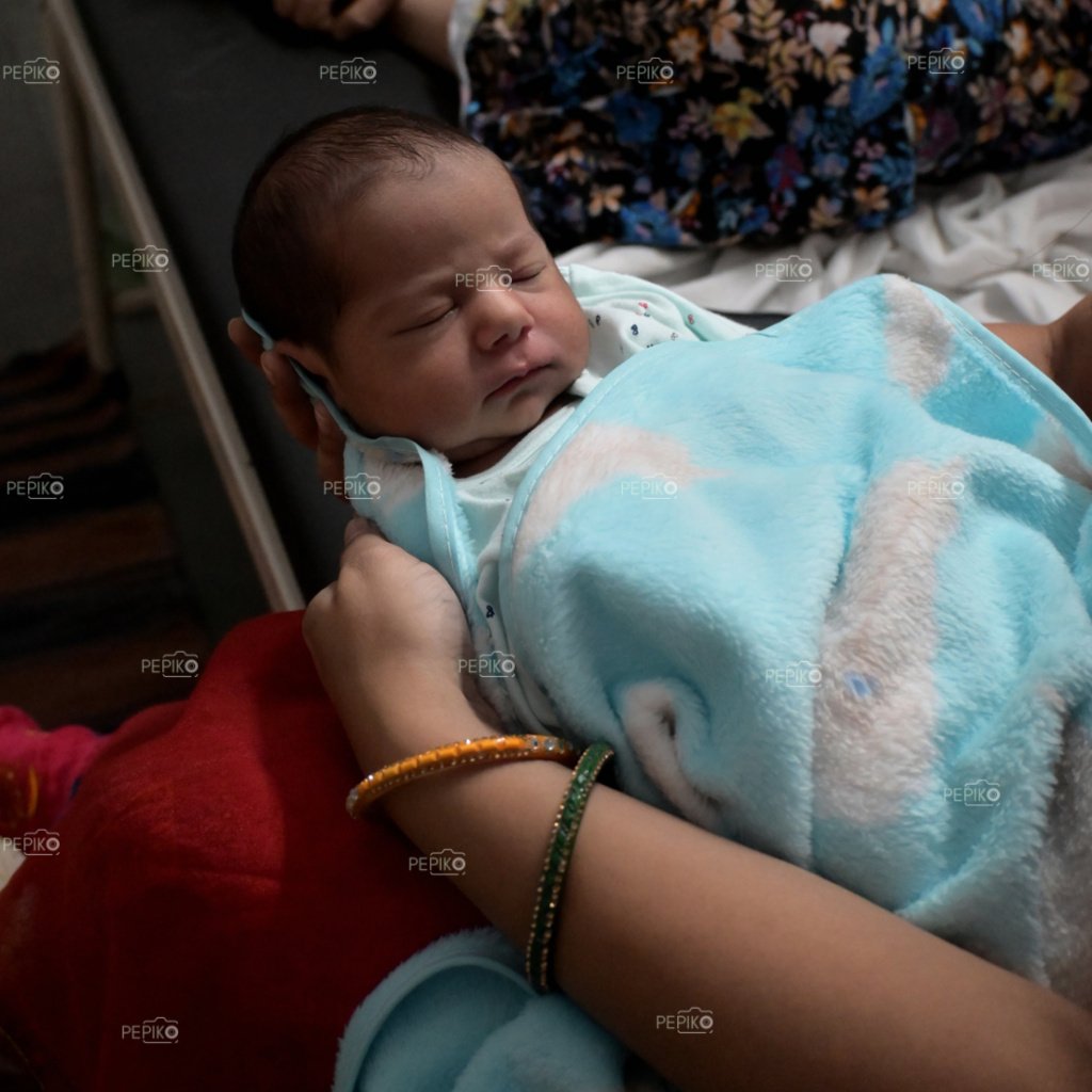 
									Cute look of New born baby boy in  sky blue dress