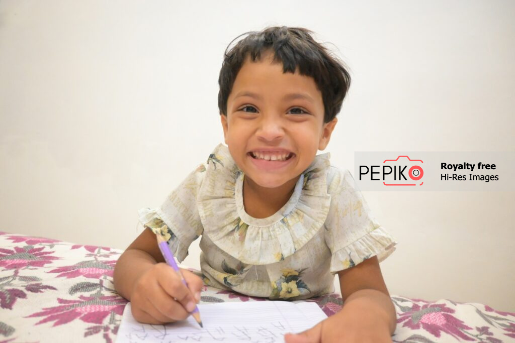 
									Young Student Completing Homework at Busy Tuition Center