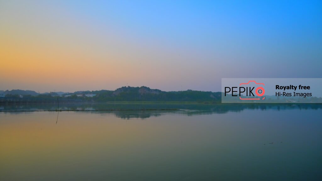 
									Colourful view of sky and water at evening time in water dam Punjab India