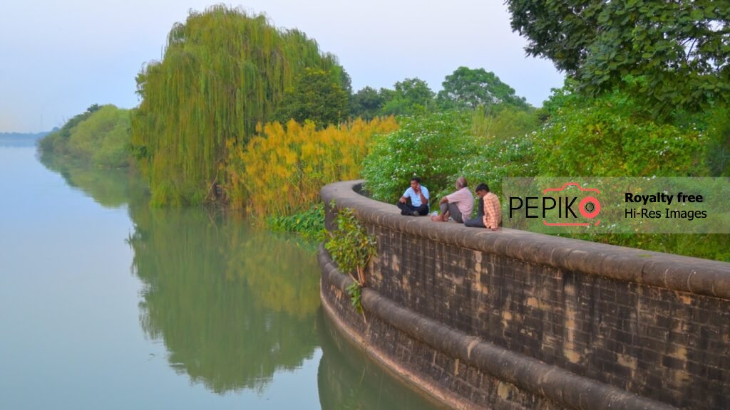 
									Colourful view of sky and water with green trees at evening time in water dam Punjab India