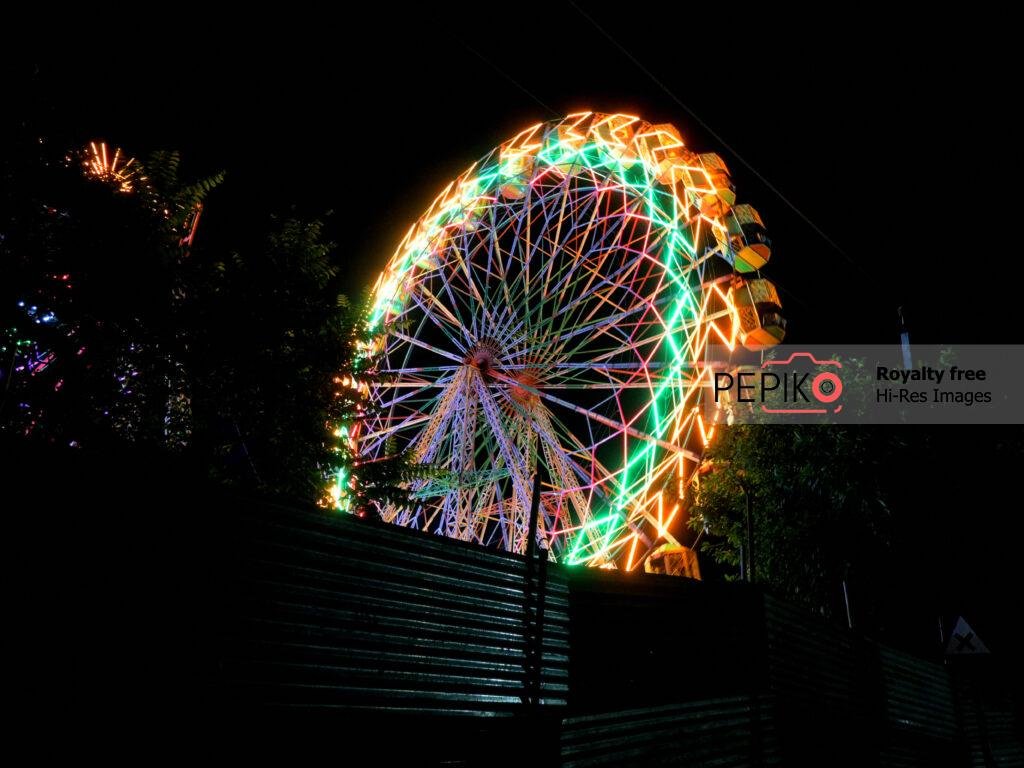 Enjoying Gaint Wheel Swings in Carnival.