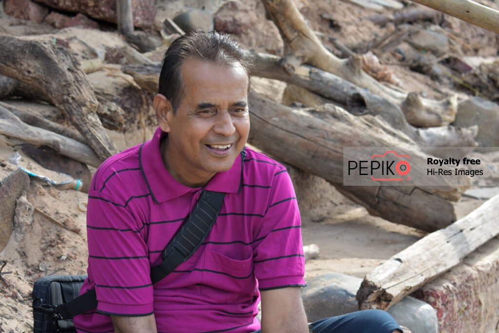 
									Picture of travel enthusiast mature person on beach in GOA India