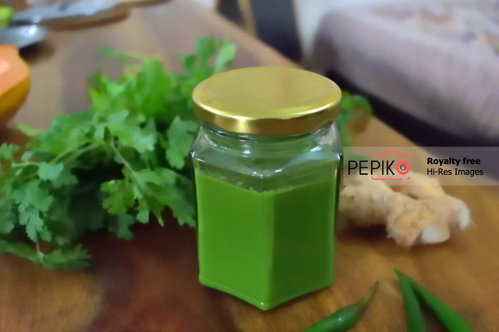 
									Spicy Green mint and chili chutney in glass jar