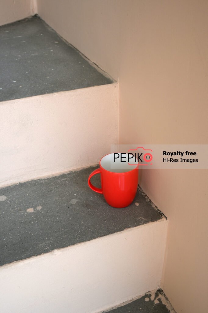 
									Picture of red mug on stairs