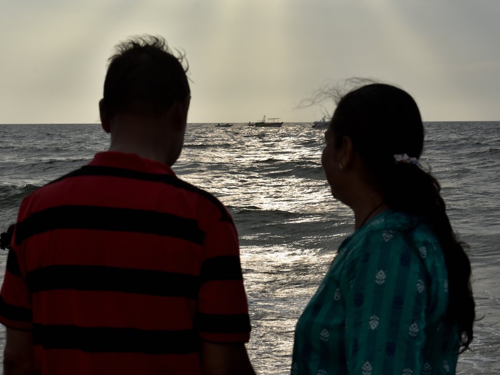 Mature husband and wife enjoying at beach