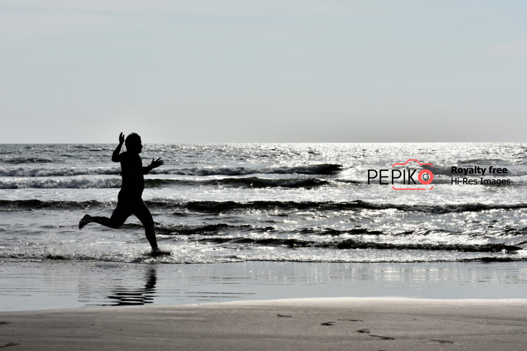 Athlete running on beach