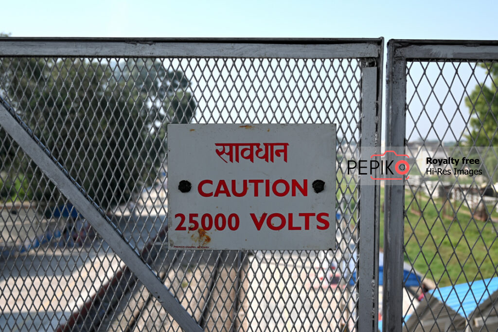 
									Danger sign board about high voltage of 25000 volts