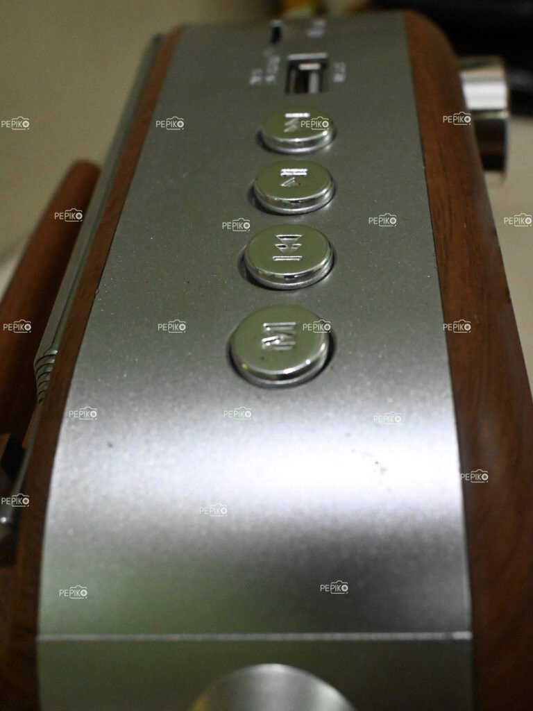 Picture of metal buttons on radio / music player