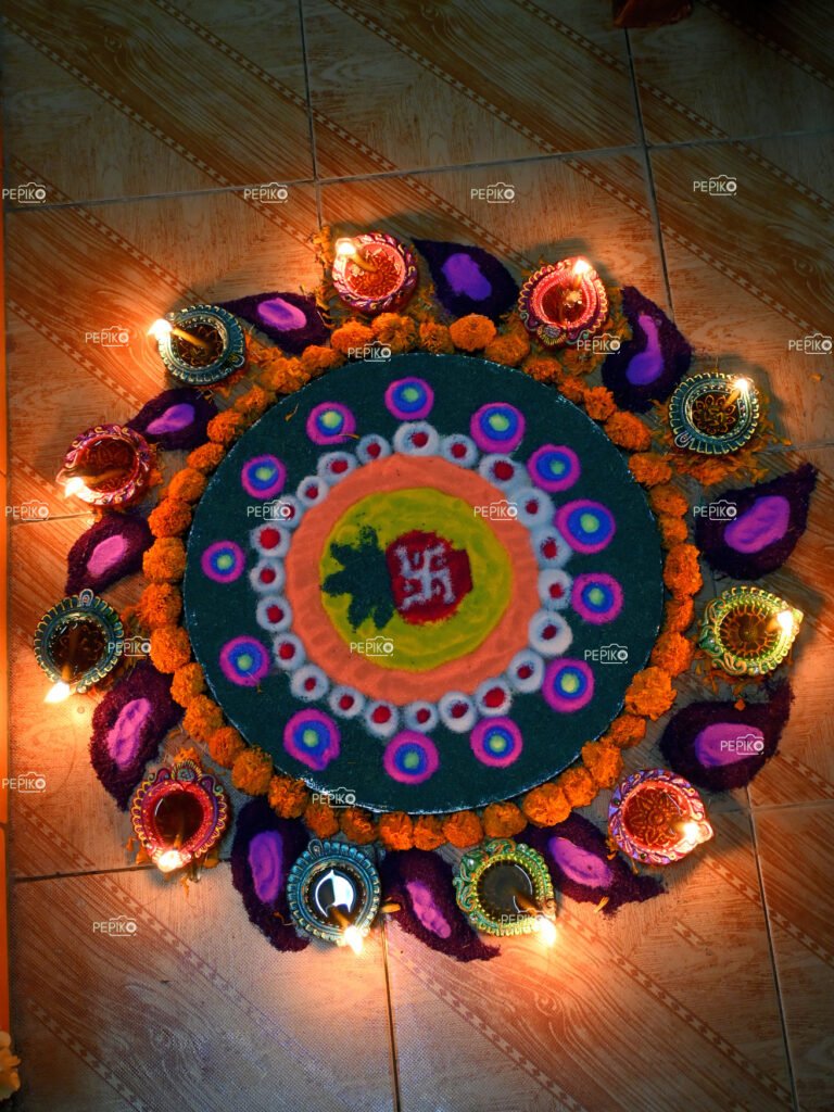 
									Beautiful rangoli prepared on Diwali festival surrounded by divas / lamps