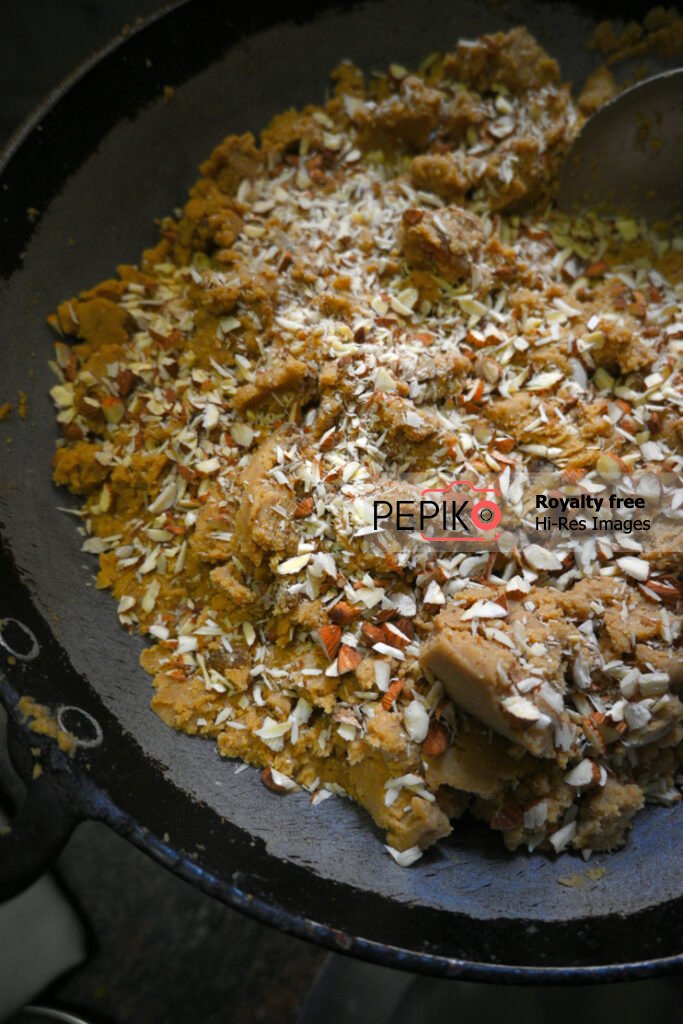 Picture of Indian Sweet dish loaded with dry fruits is being prepared for winters