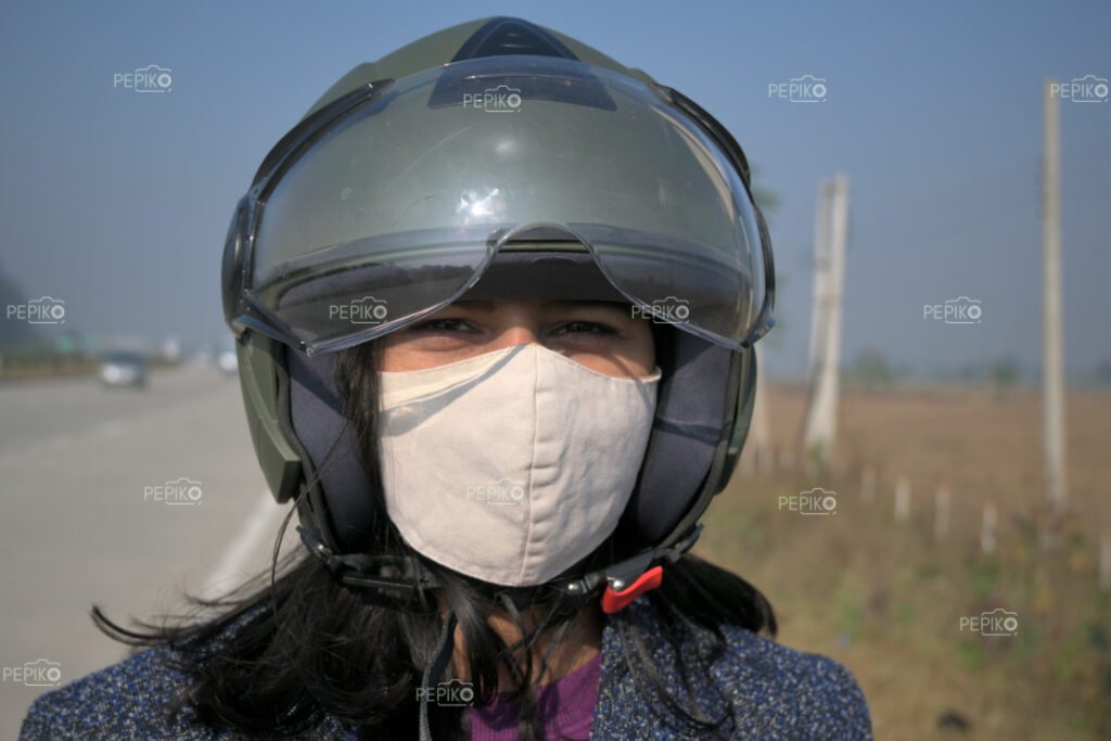 Picture of a women with bike / scooty helmet