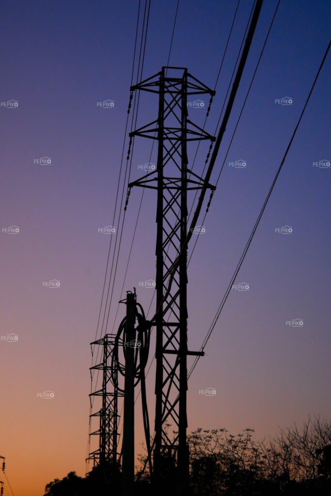 Series of electric poles / towers on road