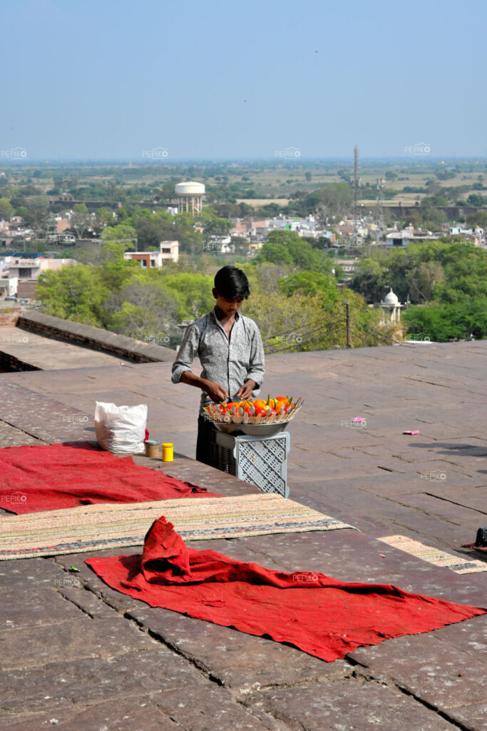 Indian boy as street vendor selling salads